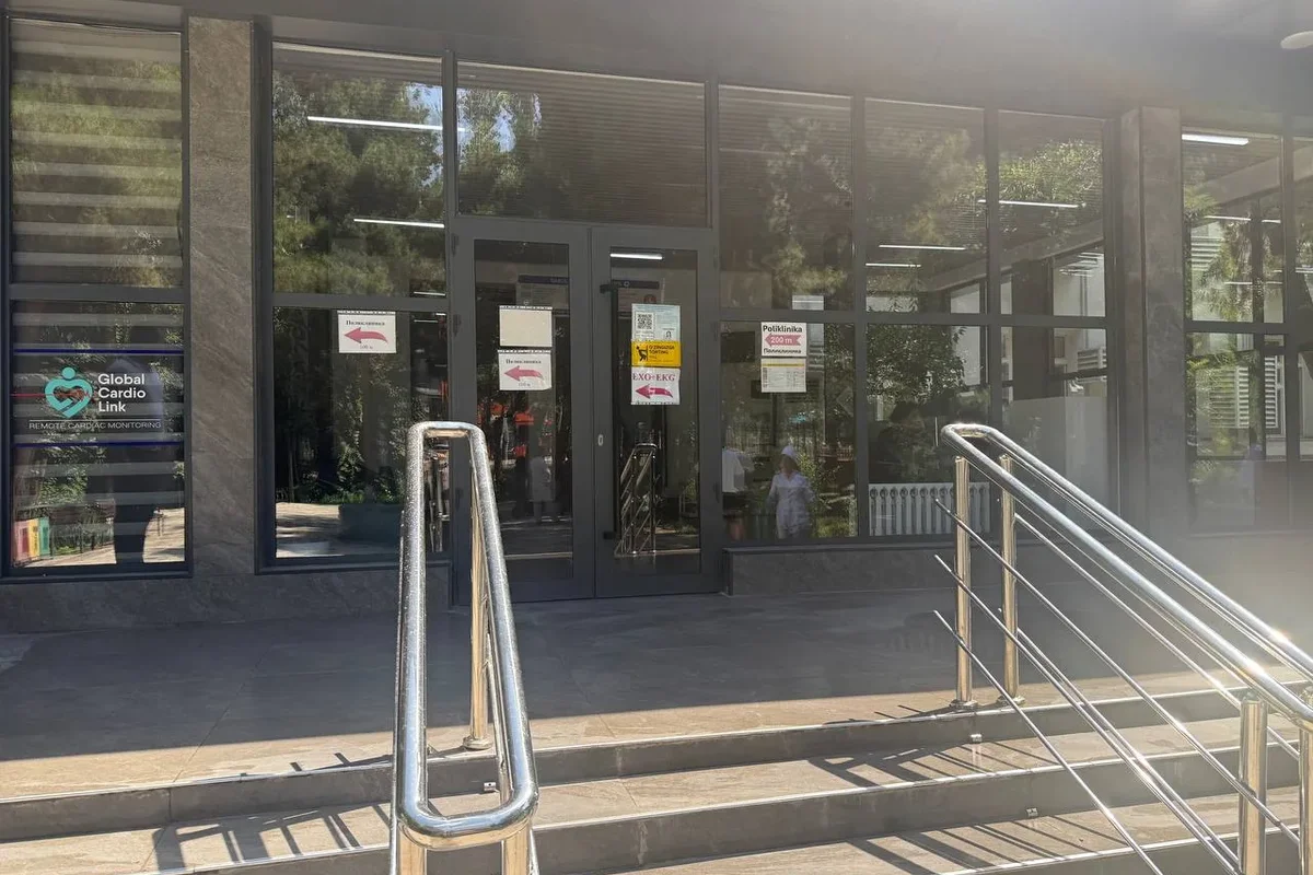 Exterior · Main entrance with stainless-steel handrails on the stairs — so patients can hold on while climbing and not fall.